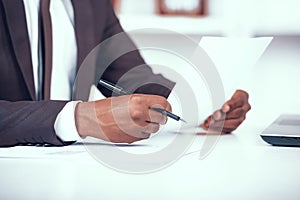 Cropped African Businessman Holding Document.