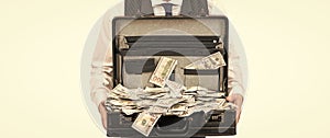 cropped briber holding case full of dollar cash isolated on white background, corruption