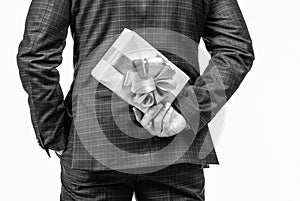 cropped businessman man hiding present box, back view, shopping