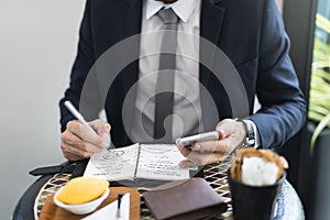 Cropped Businessman Writing Notes Journal Concept