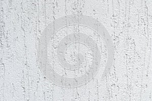 Close up photo of white rought stucco texture and background photo