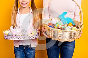 Cropped close up photo of whisker wooden baskets full of colored