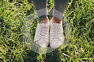 Cropped close-up view of her she nice attractive fashionable girl legs wearing casual cosy comfortable sporty sneakers