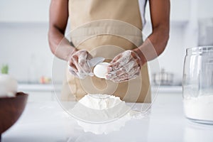 Cropped close-up view of his he her she nice attractive guy confectioner making fresh soft bread doughing flour breaking