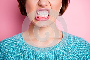 Cropped close-up view portrait of her she nice attractive fury evil cruel woman grinning teeth healthy gums anti caries