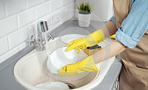 Cropped Closeup of a Person Washing Dishes