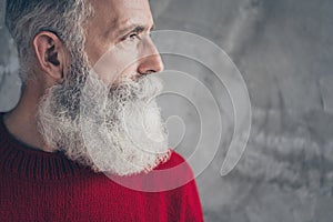 Cropped closeup photo of serious aged guy looking side empty space minded wear red knitted pullover cool hipster santa