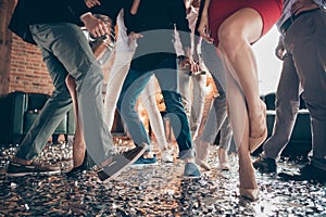Cropped closeup photo of slim tender legs girls guys meeting rejoicing dance floor x-mas party glitter flying wear