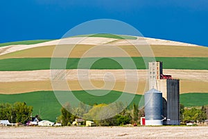 Cropped fields with grain silo