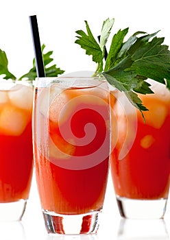 Cropped frame of Bloody Mary with ice cubes with celery isolated on white