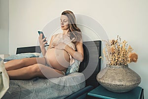 Pregnant woman in a bedroom.