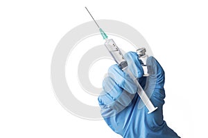 Cropped hand with medical glove holds a vial and a syringe as a vaccination concept, isolated on white background