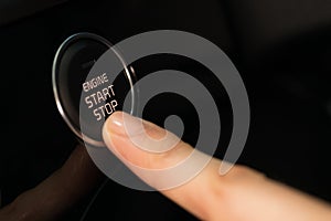 Cropped ifinger pressing car start button