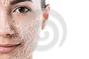 cropped image of beautiful girl with facial scrub looking at camera