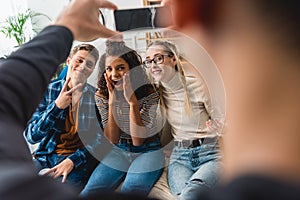 cropped image of boy taking photo of