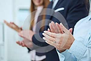 Cropped image of businesspeople clapping.