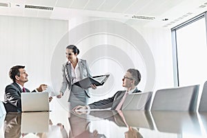 Cropped image of businesswoman using copy machine in office