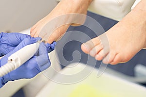 Cropped image of chiropodist with patient in clinic