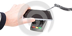 Cropped image hand man making payment with smartphone using NFC technology