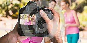 Composite image of cropped image of hands holding camera