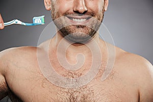 Cropped image of a happy shirtless man