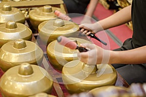 Cropped image high school boy performing traditional malay music