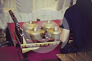 Cropped image high school boy performing traditional malay music