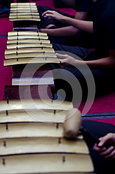 Cropped image high school boy performing traditional malay music