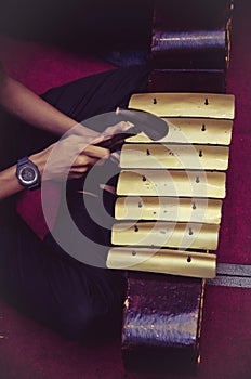 Cropped image high school boy performing traditional malay music