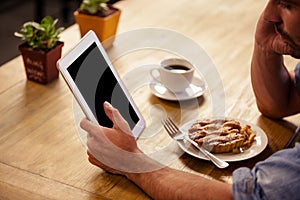 Cropped image of hipster man using tablet computer