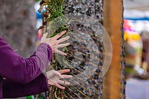 Cropped image of human hand decorating wampum photo