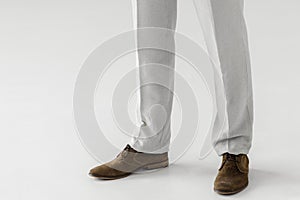 cropped image of male model in linen trousers and suede shoes