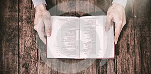 Cropped image man holding bible