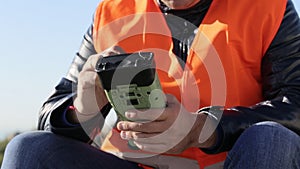 Cropped image of man working with geodetic equipment