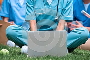 cropped image of medical student studying with laptop