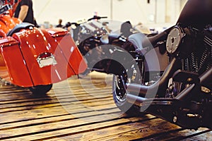 Cropped image of a new motorcycle in the store. Motorcycles and accessories in a modern motorcycle store. Bicker