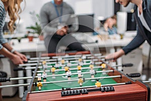 cropped image of people playing in table soccer