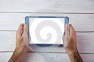 Cropped image of person holding tablet