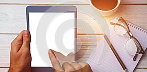 Cropped image of person using tablet