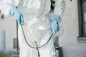 cropped image of pest control worker holding