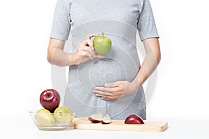 Cropped image of pregnant woman Prepare fruit salad, breakfast in the kitchen fresh and healthy food for my baby on white