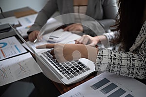 Cropped image of professional businesswoman, entrepreneur or accountant working on a financial report paperwork at her desk