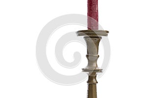 Cropped image of a retro candlestick with red candle isolated on white background