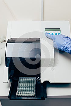 cropped image of scientist using pcr cycler in biotechnology