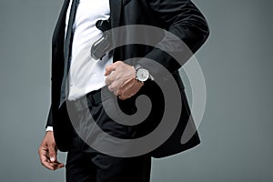 cropped image of security guard standing with gun