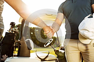 Cropped image of two men shaking hands