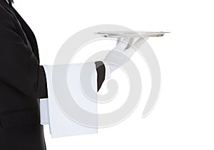 Cropped image of waiter holding empty tray photo