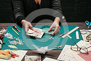 cropped image of woman adding sequins to