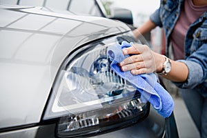 cropped image of woman cleaning car at car wash