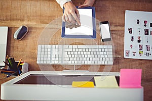 Cropped image of woman using tablet